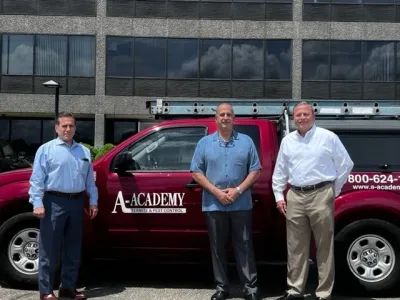 A-Academy founder standing in front of a company truck